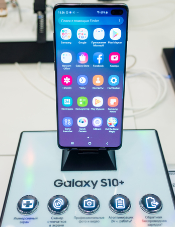 February 28, 2019 Moscow, Russia. The new smartphone from Samsung Galaxy s10+ on the shelf in the gadget store.のeditorial素材