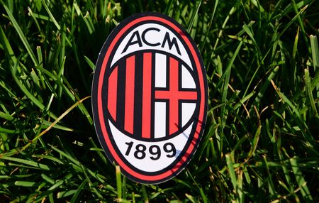 September 6, 2019 Istanbul, Turkey. The emblem of the Italian football club Milan on the green grass of the football field.のeditorial素材