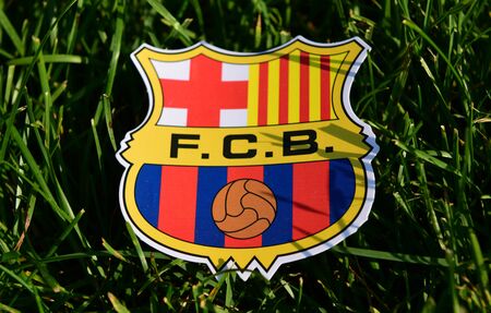 September 6, 2019 Istanbul, Turkey. The emblem of the Spanish football club Barcelona on the green grass of the football field.のeditorial素材