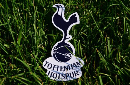 September 6, 2019 Istanbul, Turkey. The emblem of the English football club Tottenham Hotspur London on the green grass of the football field.のeditorial素材