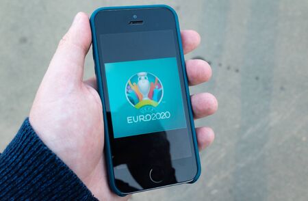 October 22, 2019. London, United Kingdom. Logo of the 2020 European Football Championship on the screen of a mobile phone.のeditorial素材