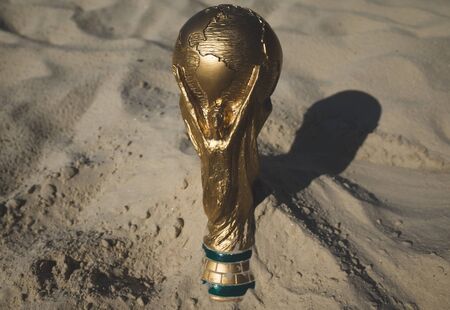 May 30, 2019. Doha, Qatar. FIFA World Cup trophy on sand. FIFA World Cup  2022  will be held in Qatar.のeditorial素材