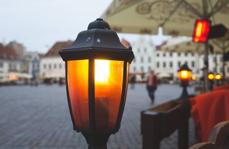 Yellow lantern on the town square of the old European city.の写真素材