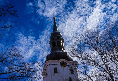 The tower of the St. Mary's Cathedral (Dome Church) in Tallinn on blue sky background with clouds.の写真素材