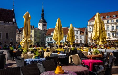 23 April 2018, Tallinn, Estonia. Tables street cafe on the square in the Old town.のeditorial素材