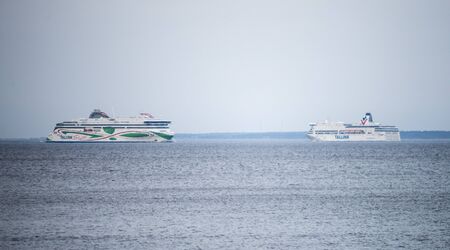 20 April 2019, Tallinn, Estonia. High-speed passenger and car ferrys of the Estonian shipping concern Tallink VICTORIA I and MEGASTAR in the port of Tallinn.のeditorial素材