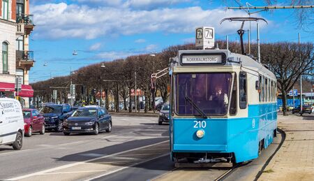 April 22, 2018, Stockholm, Sweden. Blue tram on one of the streets of Stockholm in spring clear weather.のeditorial素材