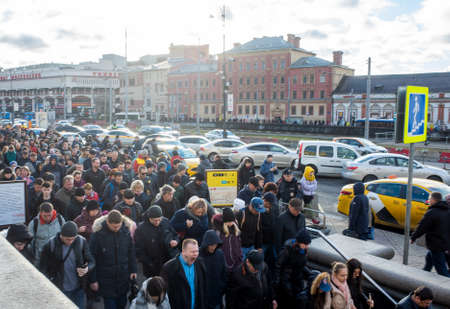 April 1, 2019 Moscow, Russia. A crowd of passengers descend into the metro during the morning rush hour on the square of Three stations in Moscow.のeditorial素材