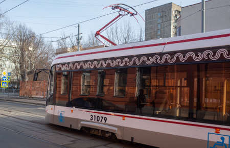 March 18, 2019, Moscow, Russia. A tram on a busy street during rush hour.のeditorial素材