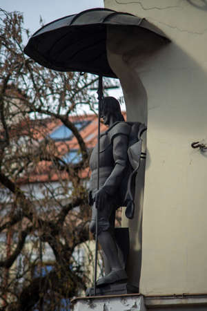 April 26, 2018 Vilnius, Lithuania. Statue City guard on the wall of the Umyastovsky Palace in Vilnius.のeditorial素材