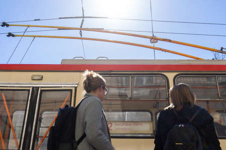 April 27, 2018 Vilnius, Lithuania. Girls at the trolley bus stop in Vilnius.