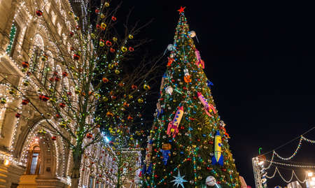 December 20, 2019. Moscow, Russia. Decorated Christmas tree on red square in front of the Gum building in Moscow at night.のeditorial素材
