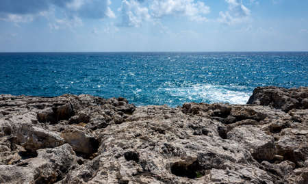 Waves crash on the rocky shore of the Mediterranean Sea on the Akamas Peninsula in the northwest of...