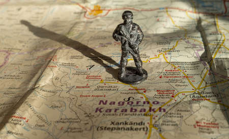 A figurine of an armed soldier on the map of Nagorno-Karabakh.のeditorial素材