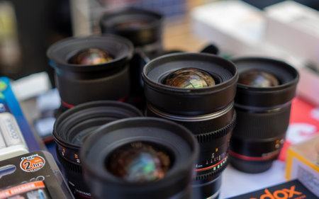 August 18, 2018 Moscow, Russia. Lenses for professional photo and video cameras from Samyang on the counter of the store.のeditorial素材