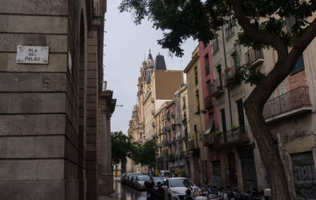 September 8, 2014. Barcelona, Spain. Parked cars and motorbikes in a quiet street in the center of Barcelona in the early morning.のeditorial素材