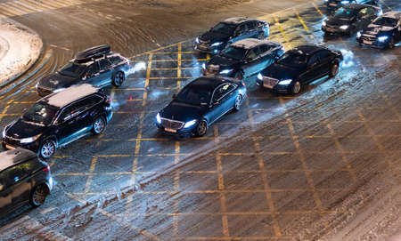 December 25, 2020, Moscow, Russia. Car traffic on Moskvoretskaya Street in Moscow during a snowfall.のeditorial素材