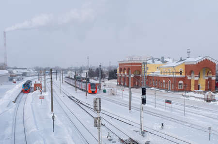 February 16, 2021, Orel, Russia. Electric train "Lastochka" at the platform of the Oryol railway station on a winter day.のeditorial素材