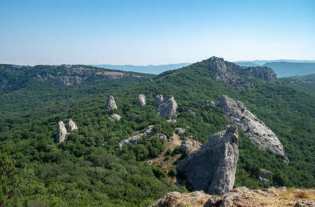 Mediterranean landscape. Forested rocks of the Black Sea coast of the southern coast of the Crimean Peninsula on a clear sunny day.の写真素材