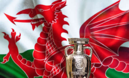 April 10, 2021. Cardiff, Wales. UEFA European Championship Cup with the Wales flag in the background.のeditorial素材