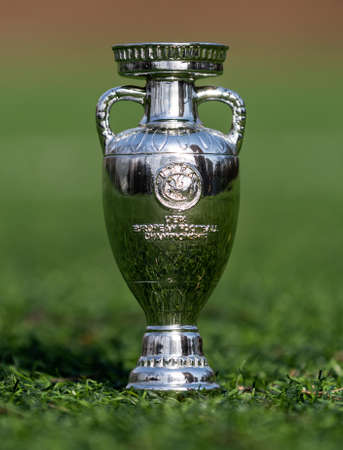 April 13, 2021 Moscow, Russia. The UEFA European Football Championship Cup on the green lawn of the football stadium.のeditorial素材