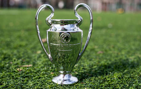 April 16, 2021 Moscow, Russia. The UEFA Champions League Cup on the green grass of the lawn.のeditorial素材