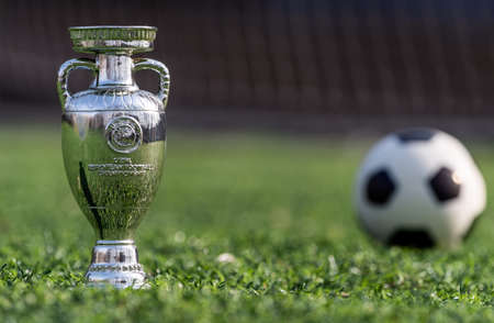 April 13, 2021 Moscow, Russia. The UEFA European Football Championship Cup on the green lawn of the football stadium.のeditorial素材