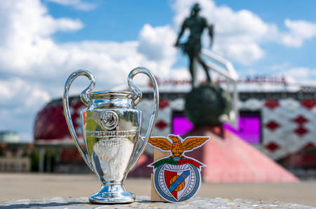 June 14, 2021 Moscow, Russia. The emblem of the Benfica football Club (Lisbon) and the UEFA Champions League Cup on the background of the Otkritie Arena stadium of the Spartak football club (Moscow).のeditorial素材