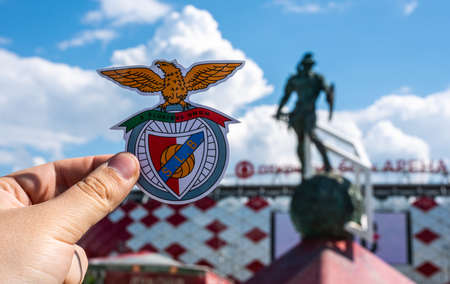 June 14, 2021 Moscow, Russia. The emblem of the Benfica football club (Lisbon) on the background of the Otkritie Arena stadium of the Spartak football club (Moscow).のeditorial素材