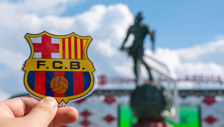 June 14, 2021 Barcelona, Spain. The emblem of the football club FC Barcelona against the background of the modern stadium.のeditorial素材