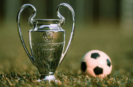 August 27, 2021 St. Petersburg, Russia. The UEFA Champions League Cup on the green turf of the...