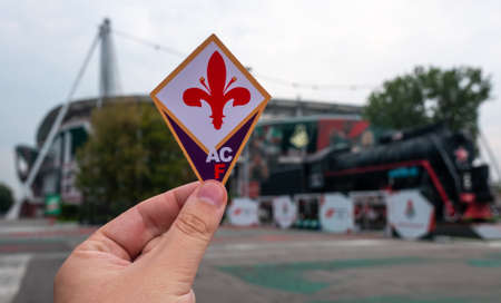 August 30, 2021, Florence, Italy. The emblem of the football club ACF Fiorentina against the background of the modern stadium.のeditorial素材