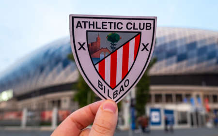 September 13, 2021 Bilbao, Spain. The emblem of the football club Athletic Bilbao against the background of the modern stadium.のeditorial素材