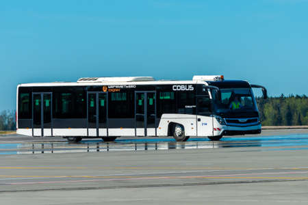 May 11, 2021, Moscow, Russia. Apron bus on the airfield of Sheremetyevo airport.のeditorial素材