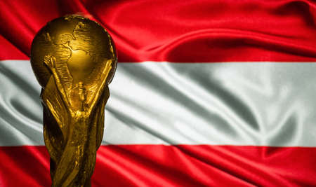 October 6, 2021 Vienna, Austria. FIFA World Cup Cup against the background of the flag of Austria.のeditorial素材