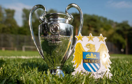 August 30, 2021 Manchester, UK. Manchester City FC football club emblem and the UEFA Champions...