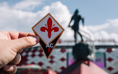 June 14, 2021, Florence, Italy. The emblem of the football club ACF Fiorentina against the background of the modern stadium.のeditorial素材