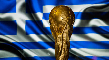 October 6, 2021 Athens, Greece. FIFA World Cup on the background of the flag of Greece.
