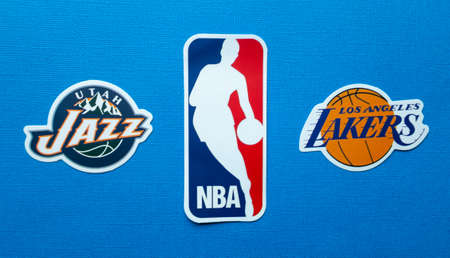 October 1, 2021, Springfield, USA, Emblems of the Los Angeles Lakers and Utah Jazz basketball teams on a blue background.のeditorial素材