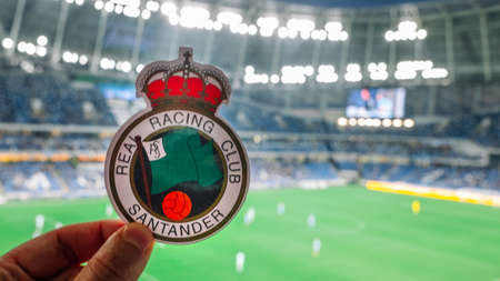 September 12, 2021, Santander, Spain. The emblem of the Racing de Santander football club against the background of a modern stadium.のeditorial素材