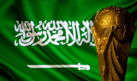 6 October 2021 Riyadh, Saudi Arabia. FIFA World Cup Cup against the background of the flag of Saudi Arabia.のeditorial素材