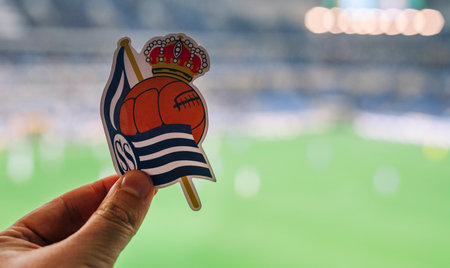 September 12, 2021, San Sebastian, Spain. The emblem of the football club Real Sociedad against the background of a modern stadium.のeditorial素材