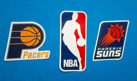 October 1, 2021, Springfield, USA, Emblems of the Phoenix Suns and Indiana Pacers basketball teams on a blue background.のeditorial素材