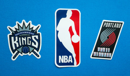 October 1, 2021, Springfield, USA, Emblems of the Sacramento Kings and Portland Trail Blazers basketball teams on a blue background.のeditorial素材