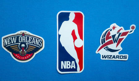 October 1, 2021, Springfield, USA, Emblems of the New Orleans Pelicans and Washington Wizards basketball teams on a blue background.のeditorial素材