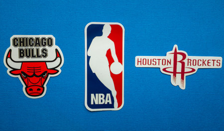 October 1, 2021, Springfield, USA, Emblems of the Houston Rockets and Chicago Bulls basketball teams on a blue background.のeditorial素材