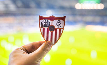 September 12, 2021, Seville, Spain. The emblem of the football club Sevilla FC against the background of a modern stadium.のeditorial素材