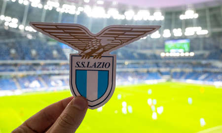 September 12, 2021, Rome, Italy. Football Club emblem SS Lazio against the backdrop of a modern stadium.のeditorial素材