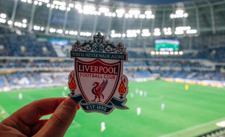September 12, 2021 Liverpool, UK. Liverpool FC Football Club emblem against the backdrop of a modern stadium.のeditorial素材