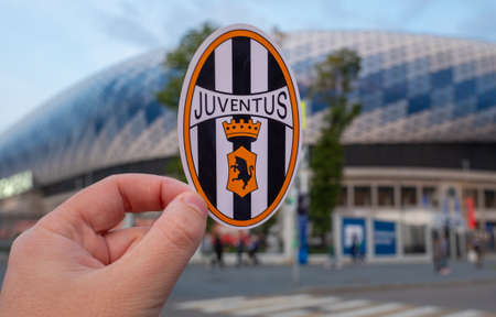 August 30, 2021, Turin, Italy. The emblem of the football club Juventus on the background of the modern stadium.のeditorial素材